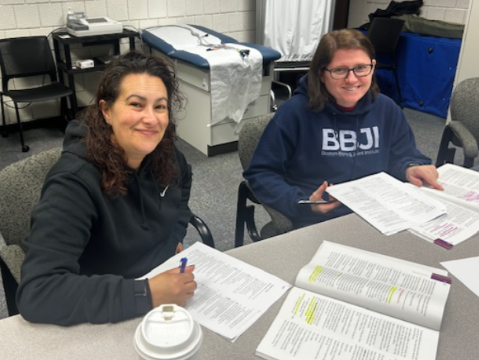 Two students posing for a photo amidst studying for their national exam.