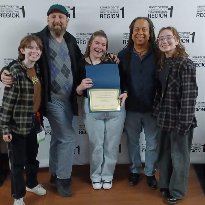 Massasoit Students and Staff smiling at music festival.