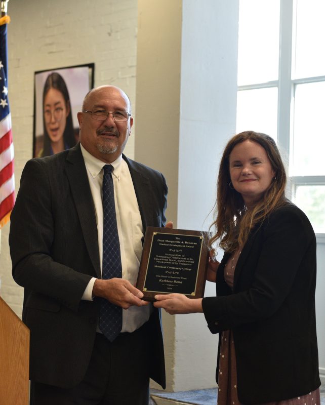 President Mitchell presenting the Marguerite Donovan Award to Kathlene Baird, Coordinator of Transfer Affairs and Articulation.