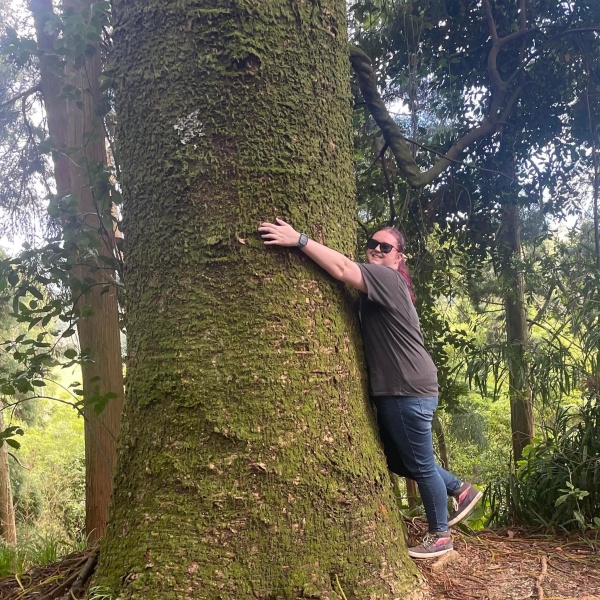 Haley hugging a tree